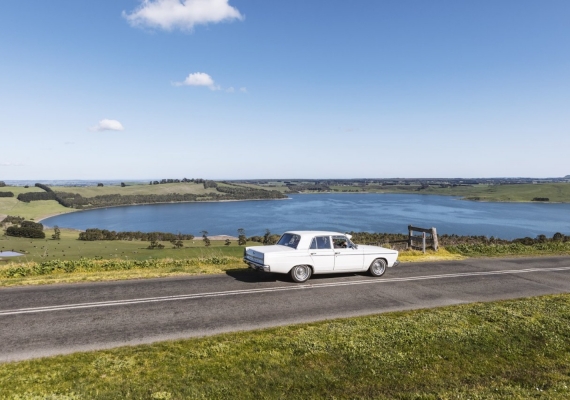 Car parked on the side of the road with Lake Bullen Merri in the background