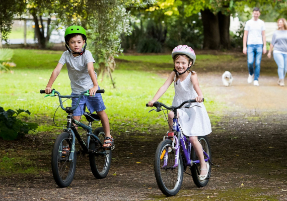 Little boy and little girl on their bike at Koroit Botanic Gardens